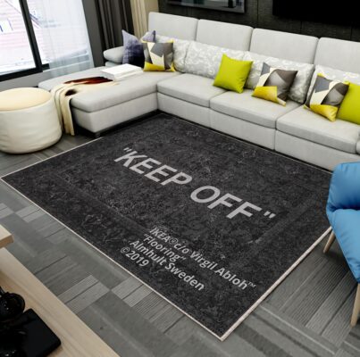 “Keep Off” rug from IKEA × Virgil Abloh collection on a living room floor, featuring bold typography design