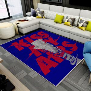 “Kiss My Airs” rug in front of a sofa, featuring bold sneaker-inspired design