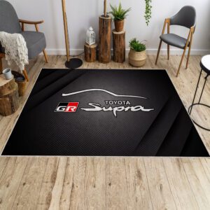 Toyota GR Supra rug in front of a sofa, featuring the iconic sports car design