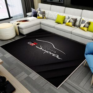 Toyota GR Supra rug on a living room or garage floor, featuring the sports car design