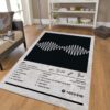 AM Arctic Monkeys rug in front of a sofa, featuring the album cover design