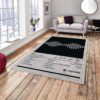 AM Arctic Monkeys rug in front of a sofa, featuring the iconic album artwork design