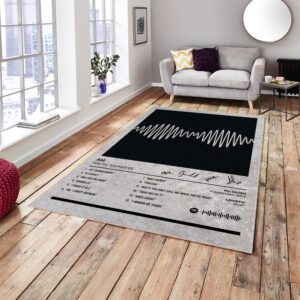 AM Arctic Monkeys rug in front of a sofa, featuring the iconic album artwork design