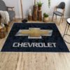 Blue Chevrolet area rug on a wooden floor