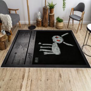 “For All the Dogs” rug in front of a sofa, featuring album artwork and design