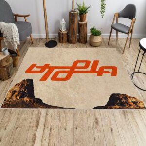Travis Scott Utopia album cover rug in front of a sofa, featuring the album artwork design