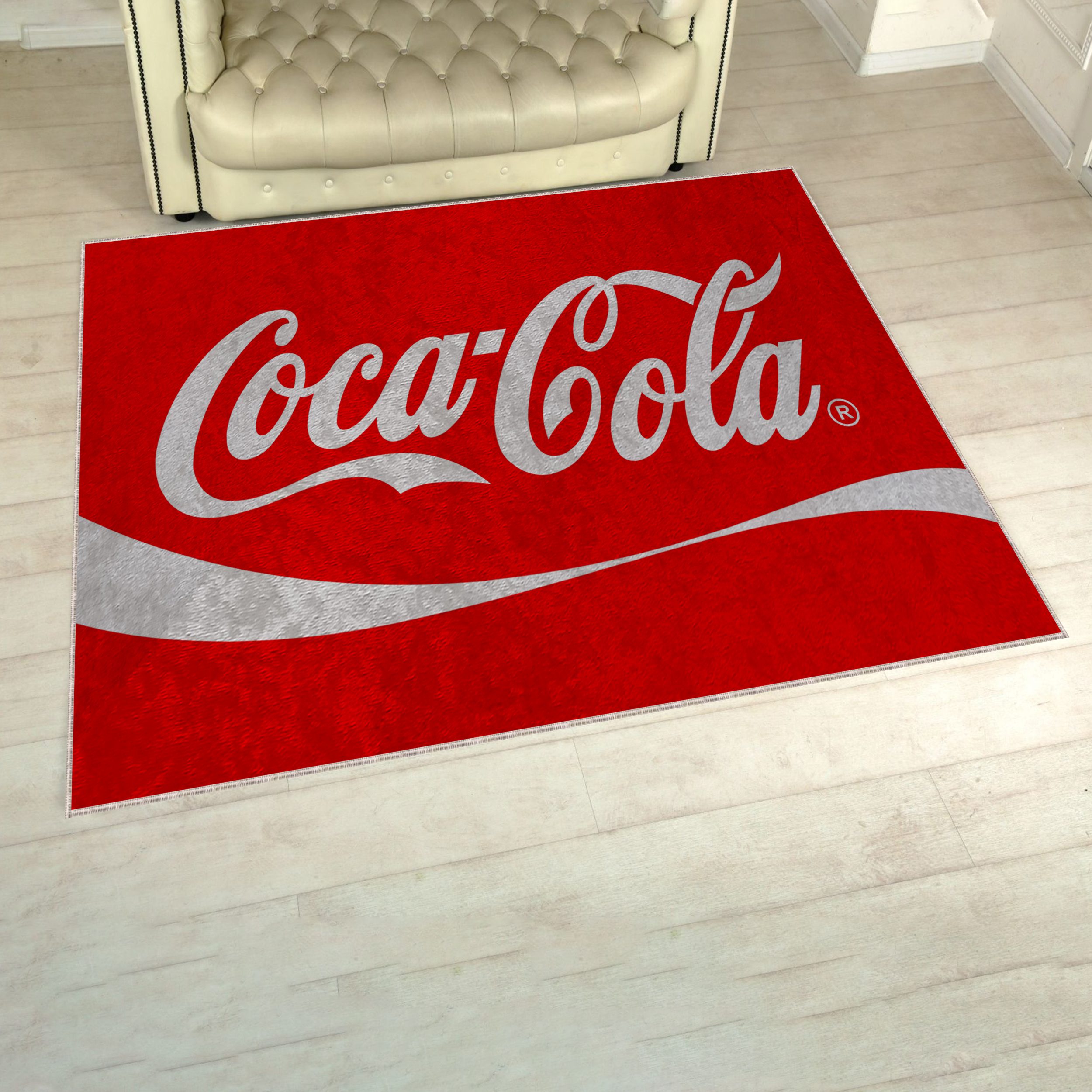 CocaCola logo rug on the floor in a cozy living room